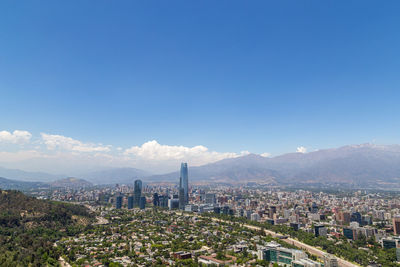 High angle view of cityscape against clear blue sky