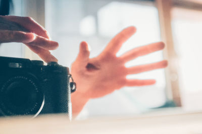 Close-up of hand holding camera