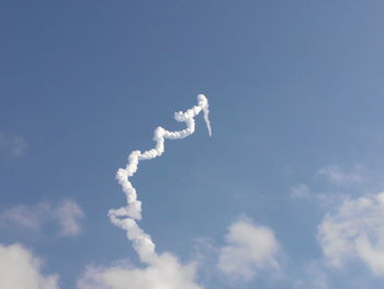 Low angle view of vapor trail against sky