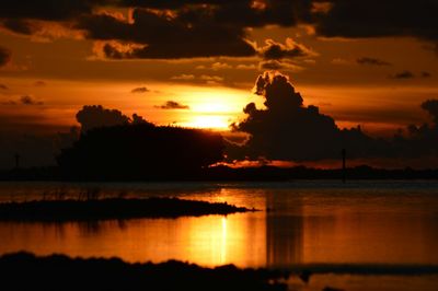 Scenic view of dramatic sky over lake