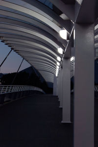 Low angle view of illuminated corridor of building