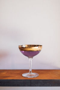 Close-up of wineglass on table