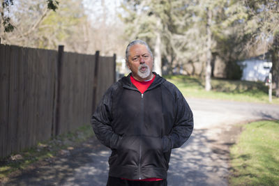 Full length of smiling man standing outdoors