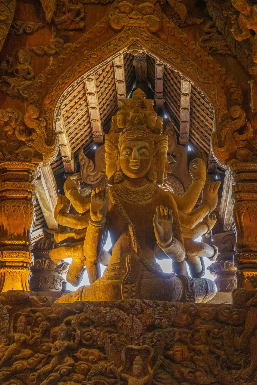 religion, belief, temple - building, spirituality, architecture, travel destinations, history, building, sculpture, the past, travel, ancient history, place of worship, built structure, no people, craft, representation, ancient, art, tourism, human representation, statue, gold, tradition, temple, indoors