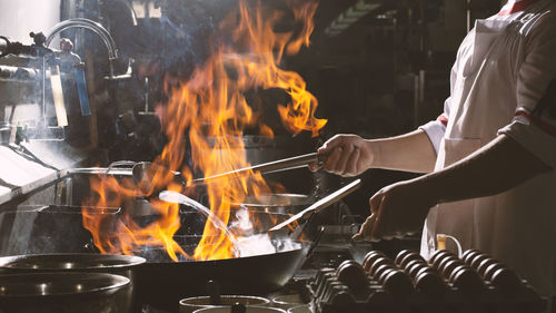 Panoramic shot of people in cooking pan