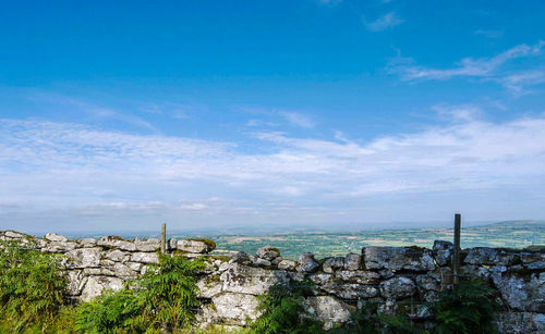 Stone wall with landscape in background