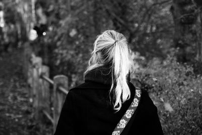 Rear view of woman in forest