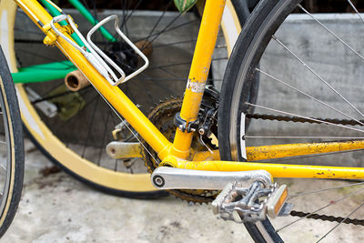 High angle view of yellow bicycle parked on street