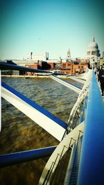 Bridge over water against clear sky