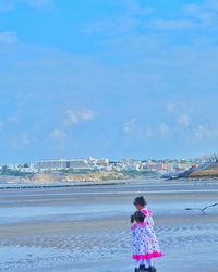 Woman standing at seaside