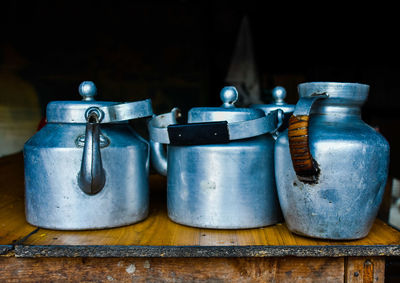 Close-up of teapots on table