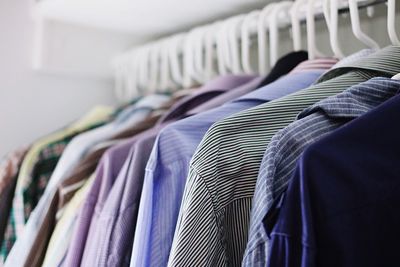 Close-up of clothes hanging on rack in store