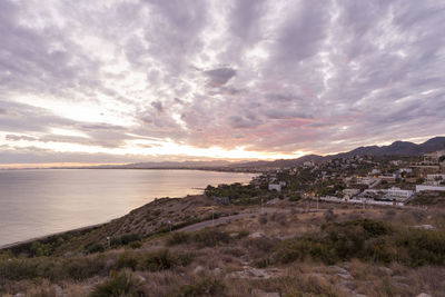 Scenic view of sea against sky at sunset