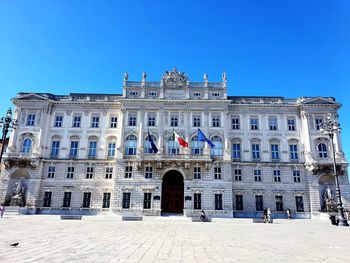 Low angle view of building against blue sky