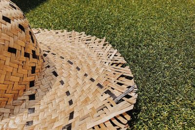 High angle view of straw hat on grass