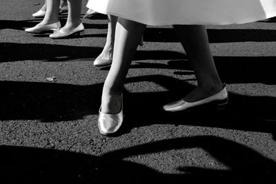 Low section of women standing on floor