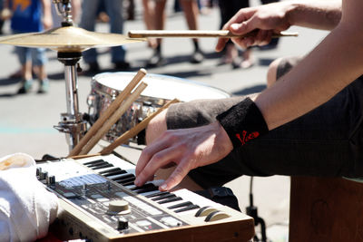 Cropped image of street musician playing music