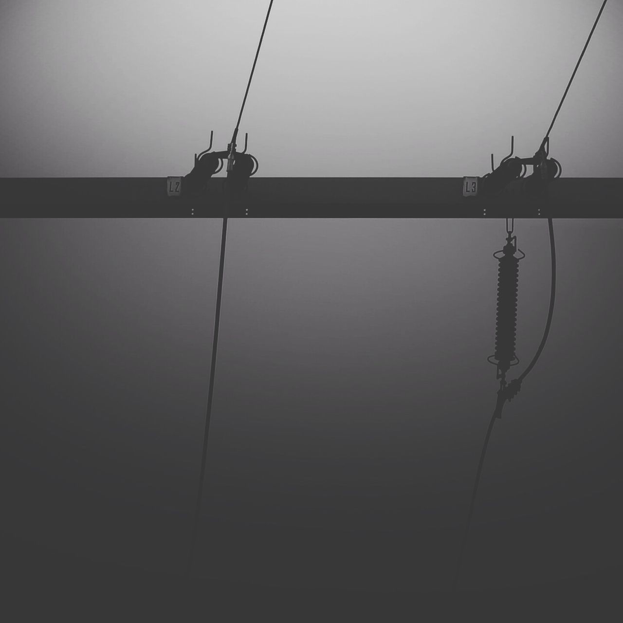 electricity, power line, low angle view, power supply, cable, connection, electricity pylon, technology, fuel and power generation, clear sky, lighting equipment, sky, street light, silhouette, power cable, copy space, no people, day, hanging, outdoors