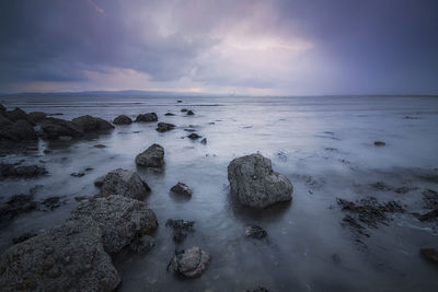 Scenic view of sea against cloudy sky