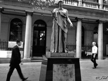 Full length of woman standing in city