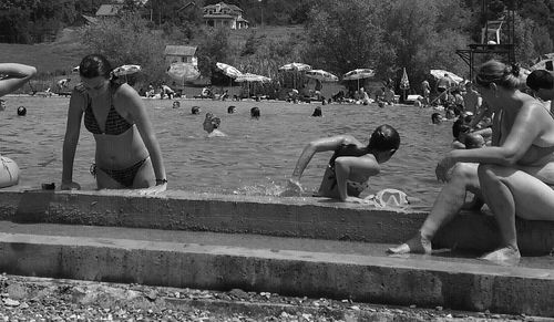 People sitting at riverbank