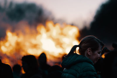 Portrait of friends against orange sky