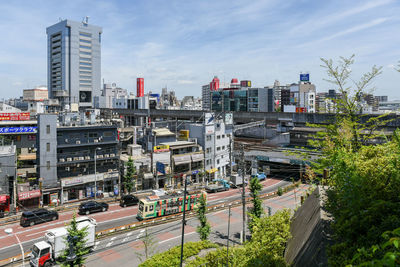 High angle view of buildings in city against sky