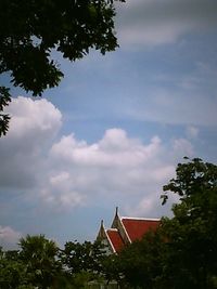 Low angle view of building against cloudy sky
