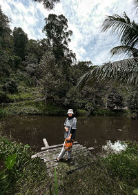 Full length of a girl on lake against sky