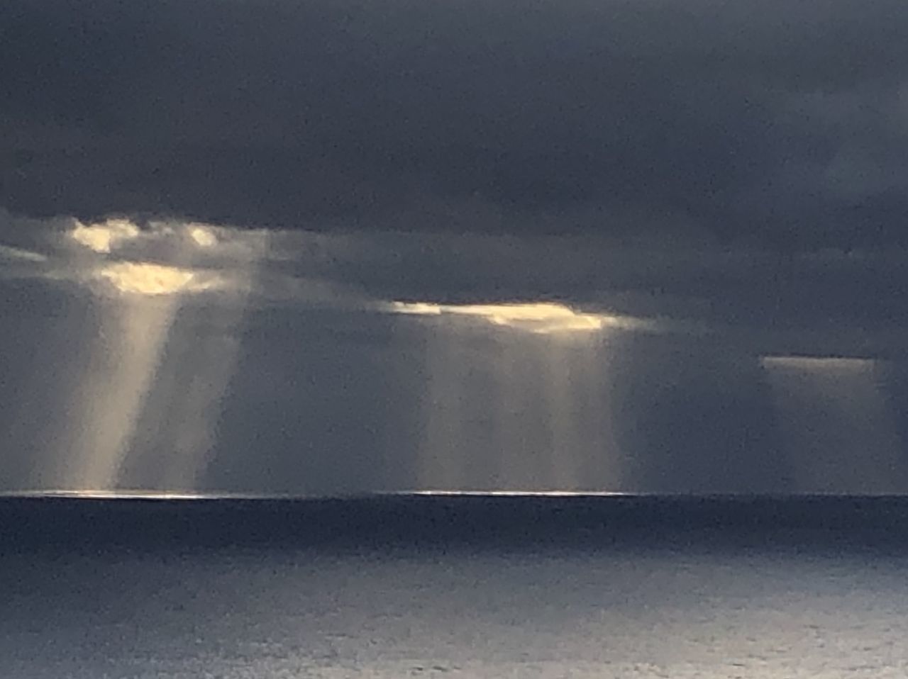 cloud, horizon, water, nature, sky, no people, sunlight, light, environment, outdoors, sea, wet, storm, beauty in nature, wave