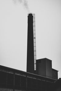 Low angle view of factory against sky