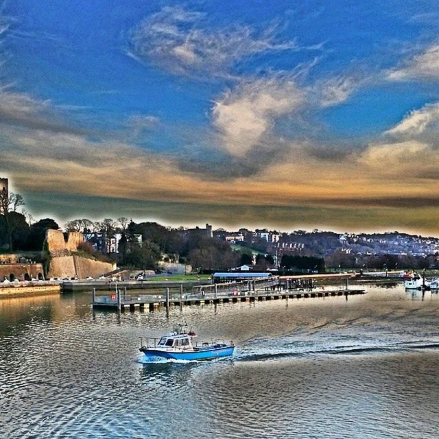 water, sea, built structure, architecture, sky, waterfront, nautical vessel, transportation, building exterior, cloud - sky, scenics, beach, boat, mode of transport, tranquility, tranquil scene, beauty in nature, nature, sunset, incidental people