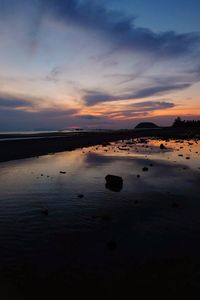 Scenic view of sea against sky at sunset