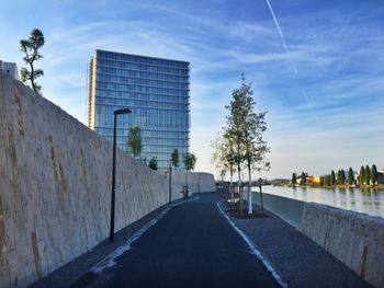 Road amidst buildings against sky in city