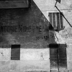 Closed door and windows of old building