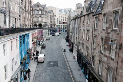 Panoramic view of people on street in city