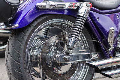 Close-up of motorcycle parked on road