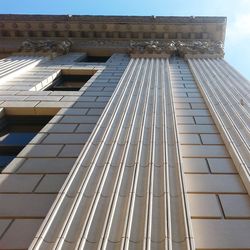 Low angle view of modern building against clear sky