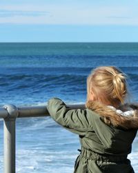 Rear view of woman looking at sea