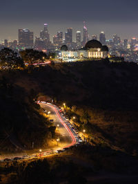 Fourth of july fireworks over griffith observatory with the los angeles skyline in the distance