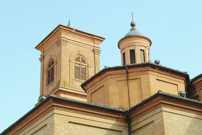 Low angle view of bell tower against clear sky