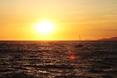 Scenic view of sea at sunset