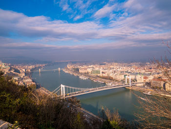 High angle view of bridge over river against cloudy sky