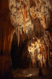 Low angle view of illuminated cave