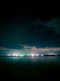 Scenic view of sea against sky at night