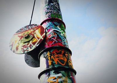 Low angle view of multi colored wall against sky