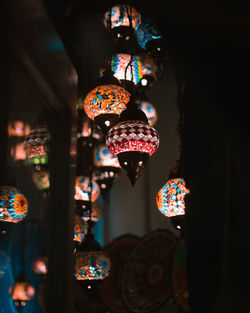 Low angle view of illuminated lanterns hanging on ceiling