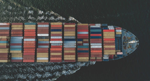 High angle view of multi colored umbrellas hanging over water