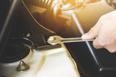 High angle view of person holding machine