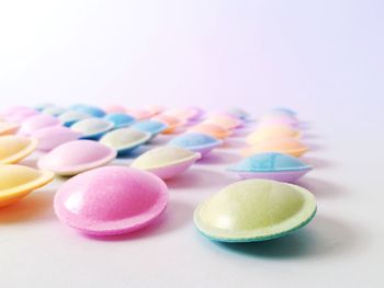 Colorful candies against white background